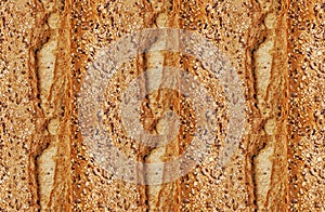Pattern texture repeating seamless. Homemade fresh crunchy sourdough bread. Background. Ð¡lose up view from top.