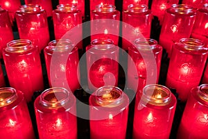 Rows of Votive candles in catholic church