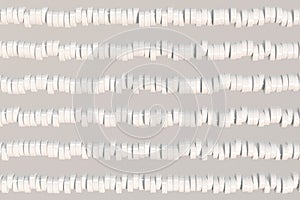 Pattern of white cylinder tablets on white background