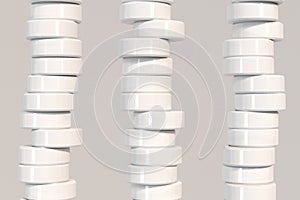 Pattern of white cylinder tablets on white background