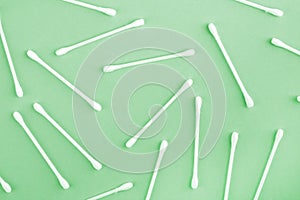 Pattern of white plastic cotton swabs or sticks top view