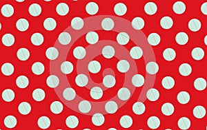 Pattern of white round pills on a red background, top view, flat lay