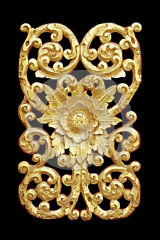 Pattern of wood carve gold paint for decoration on black.