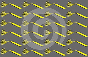 A pattern with a yellow stroke from a yellow felt-tip pen on a gray background