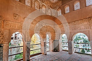 Patterned arches inside the arabic architecture style palace, 14th century fortress complex of Alhambra