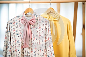 patterned bow blouses on hangars