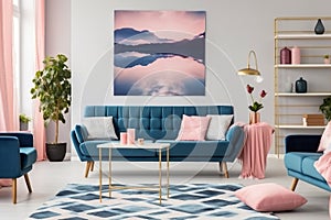 Patterned carpet in pink and blue living room interior with sofa against white wall with painting