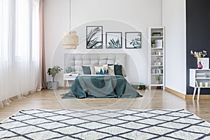 Patterned carpet in bright bedroom
