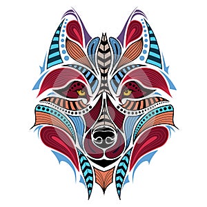 Patterned colored head of the wolf. African / indian / totem / tattoo design