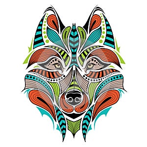 Patterned colored head of the wolf. African / indian / totem / tattoo design.