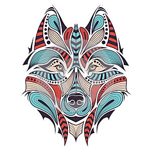 Patterned colored head of the wolf. African / indian / totem / tattoo design. It may be used for design of a t-shirt