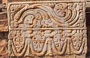 Patterned design of stone relief on wall of 7th century temple in Pattadakal, India. UNESCO World Heritage site