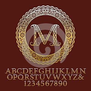 Patterned gold letters and numbers with initial monogram.