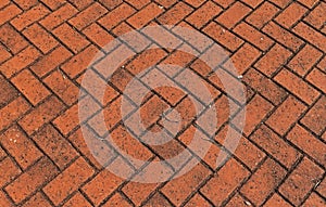 Patterned paving with red bricks