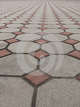 Patterned paving tiles