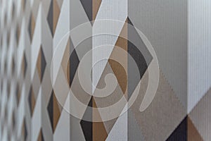A patterned wallpaper with brown and white squares