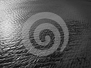 Patterns created ÃÂ¾n the sand by waves and wind, sand pattern