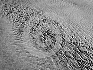 Patterns created ÃÂ¾n the sand by waves and wind, sand pattern