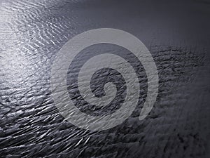 Patterns created ÃÂ¾n the sand by waves and wind