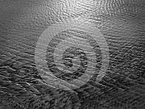 Patterns created ÃÂ¾n the sand by waves and wind