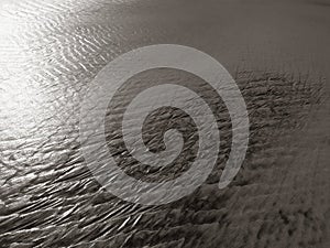 Patterns created ÃÂ¾n the sand by waves and wind, sand pattern as background
