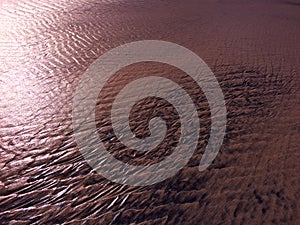 Patterns created ÃÂ¾n the sand by waves and wind, sand pattern as background