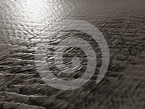 Patterns created ÃÂ¾n the sand by waves and wind