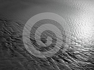Patterns created ÃÂ¾n the sand by waves and wind, sand pattern