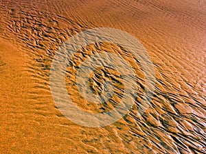 Patterns created ÃÂ¾n the sand by waves and wind, sand pattern
