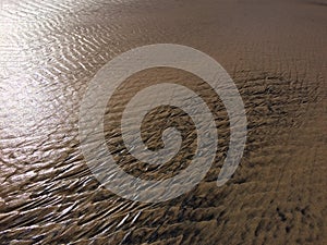 Patterns created ÃÂ¾n the sand by waves and wind, sand pattern