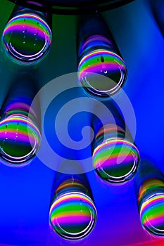 Patterns of light and color created by water drops refracting light/abstract background with rainbow colors