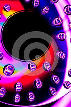 Patterns of light and color created by water drops refracting light/abstract background with rainbow colors and copy space