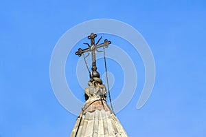 Patterns pigeons and faces on the top of an umbrella dome with a forged openwork cross on the main church of Katoghike in the Gegh