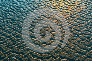 Patterns in the sand on the beach at sunset near Bayshore, Oregon, USA