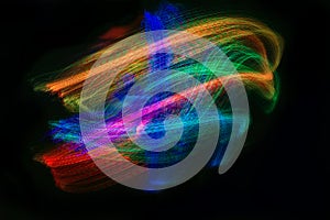 Patterns of swirling, multicoloured fibre optic lights. Abstract background.