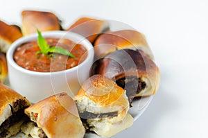 Patty`s pies stuffed with minced meat, mushrooms and onion, served with sauce