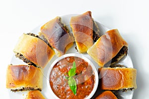Patty`s pies stuffed with minced meat, mushrooms and onion, served with sauce