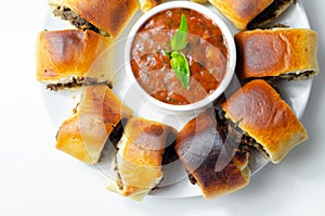 Patty`s pies stuffed with minced meat, mushrooms and onion, served with sauce