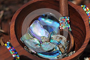 Paua shell pieces in handcrafted beaded wooden bowl