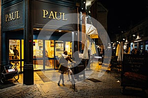 Paul Boulangerie Et Patisserie with customer waiting on bike