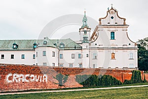 Pauline Fathers Monastery on Skalka in Krakow with Cracovia graffitti on the brick wall. photo