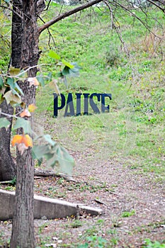 Pause signage in park