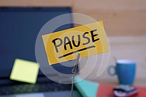 Pause written on a memo