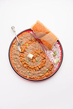 Pav bhaji is a popular Indian street food that consists of a spicy mix vegetable mash & soft buns