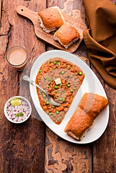 Pav bhaji is a popular Indian street food that consists of a spicy mix vegetable mash & soft buns