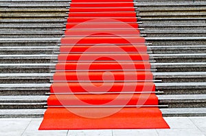 Pave in red carpet stairs photo