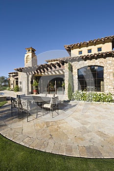 Paved Dining Area Against Modern House