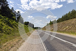 small hills through which the highway passes photo