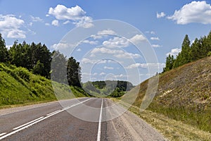 small hills through which the highway passes photo