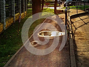 Paved road with puddles